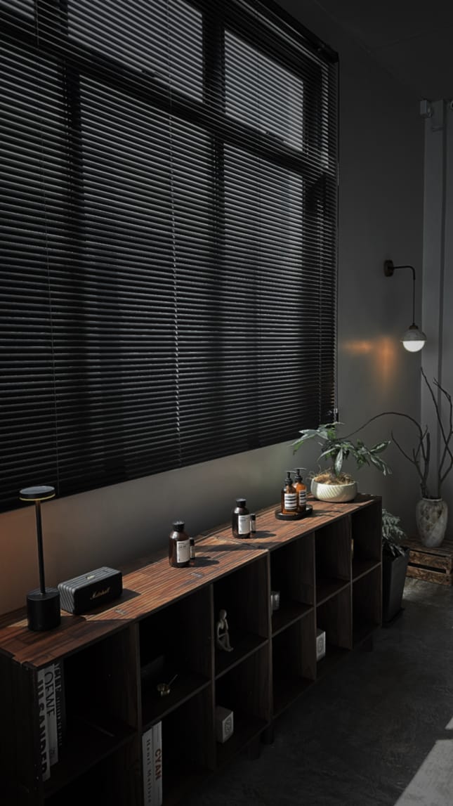 The Facialist Studio interior — warm light, clean shelving, plants